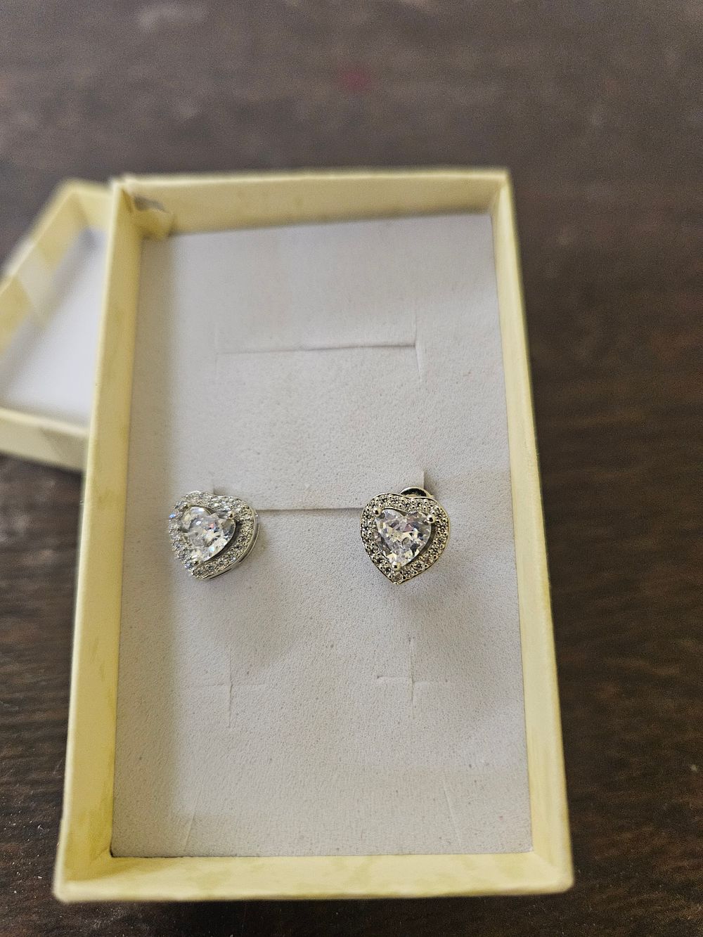 Lot 428 – A Pair of Heart-Cut Clear Gemstone Halo Stud Earrings