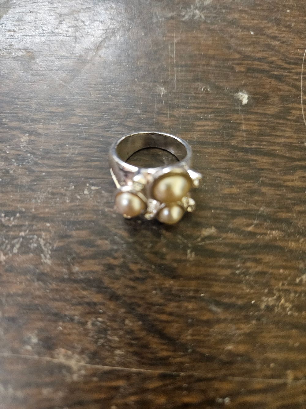 Lot 445 – A Multi-Stone Pearl and White Metal Cluster Dress Ring