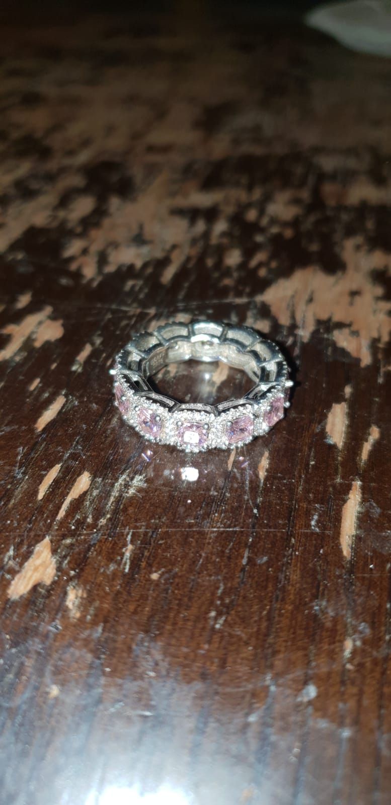 Lot 513 – A Sterling Silver and Pink Cubic Zirconia Eternity Band