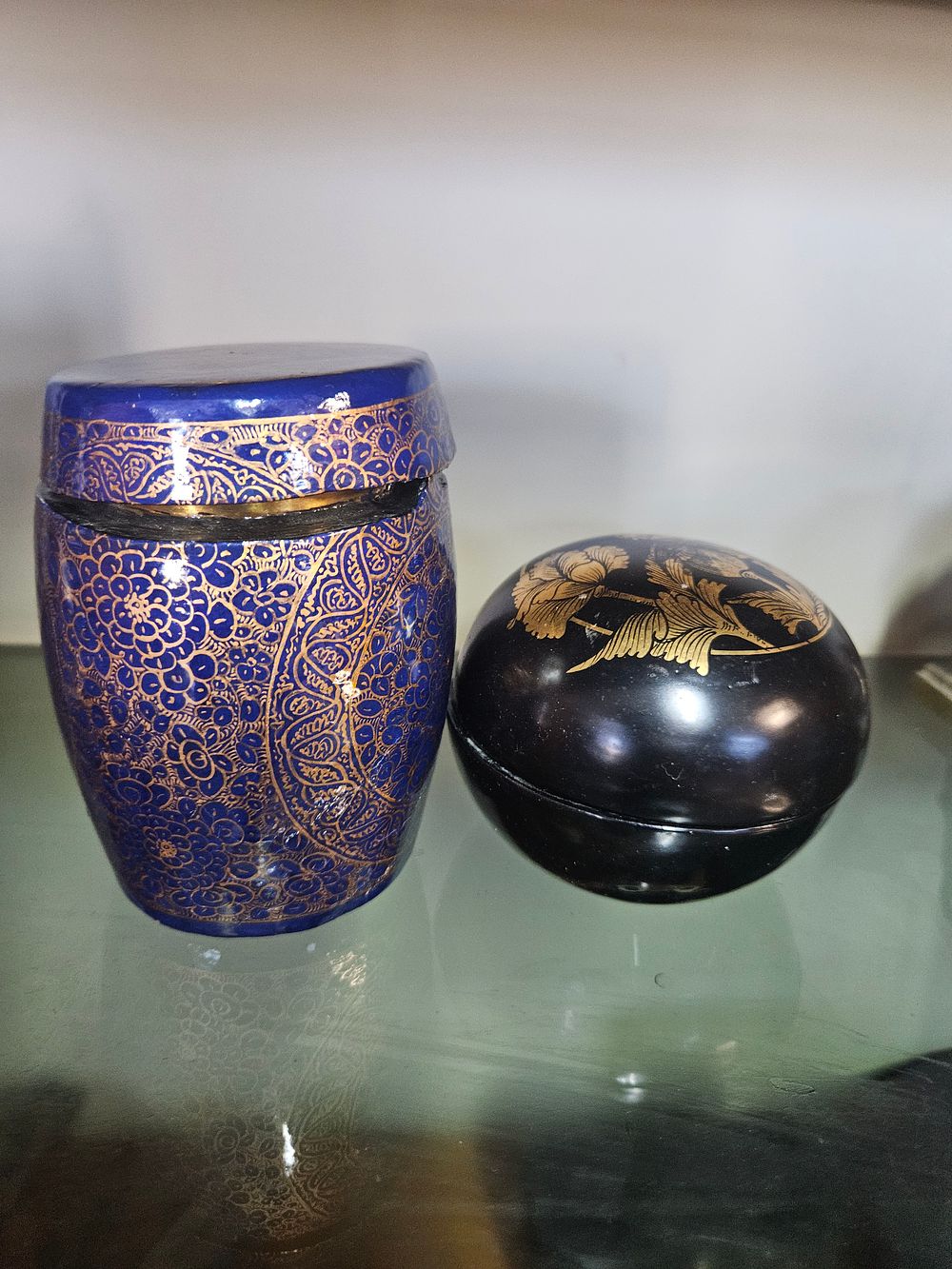 Lot 200 – Two Asian decorative lidded containers comprising a Kashmiri papier-mache jar and a black lacquer circular box
