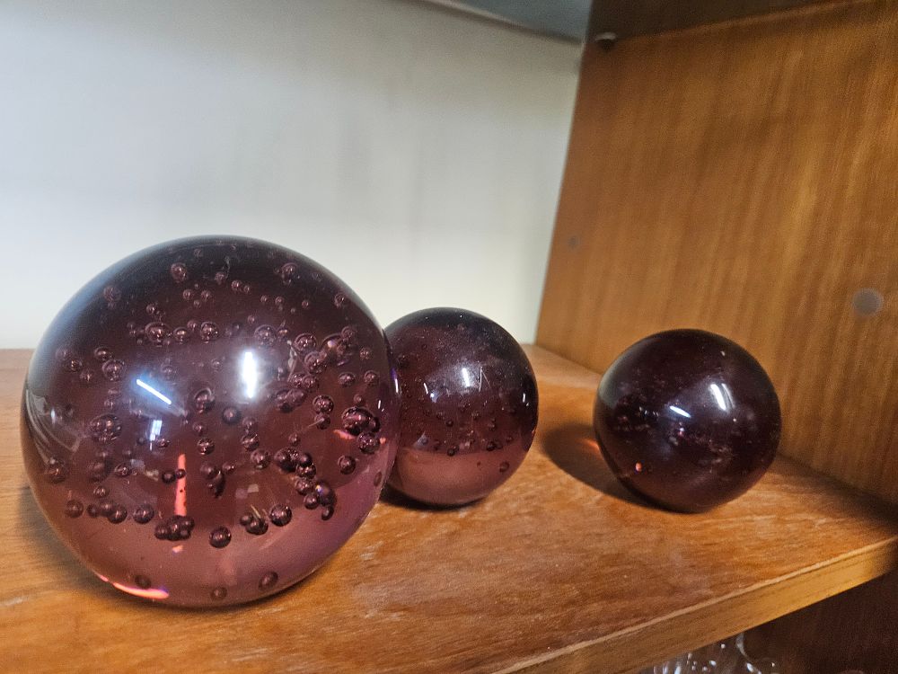 Lot 213 – A Trio of Graduated Amethyst Controlled Bubble Art Glass Spheres