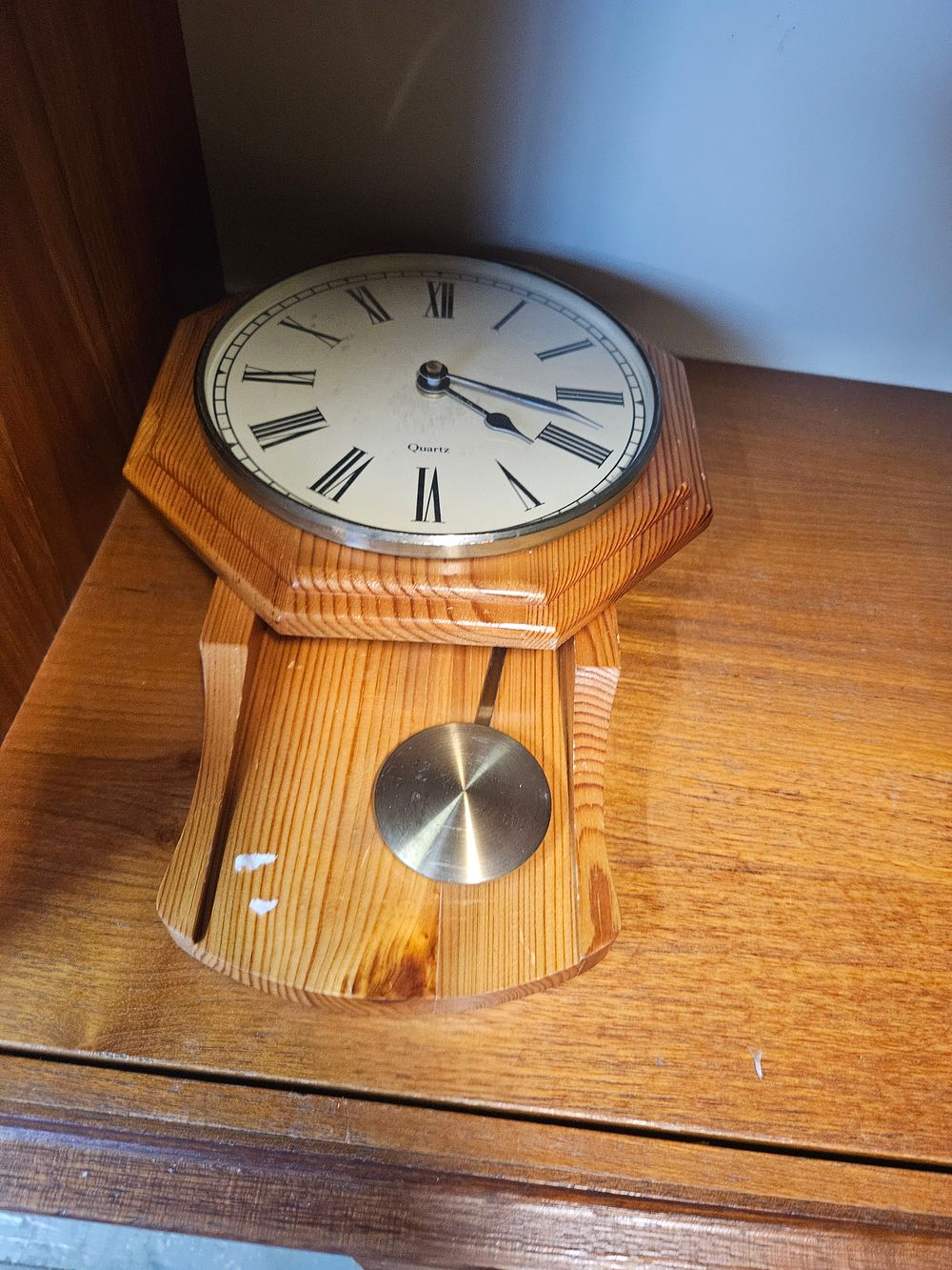 Lot 216 – A late 20th-century pine-cased quartz pendulum wall clock