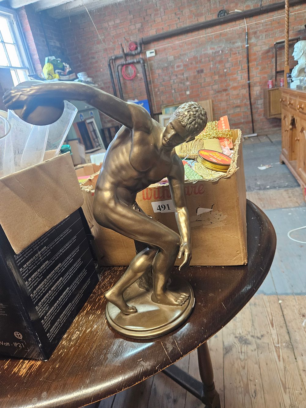 Lot 220 – A Decorative resin Sculpture of a Nude Male Athlete