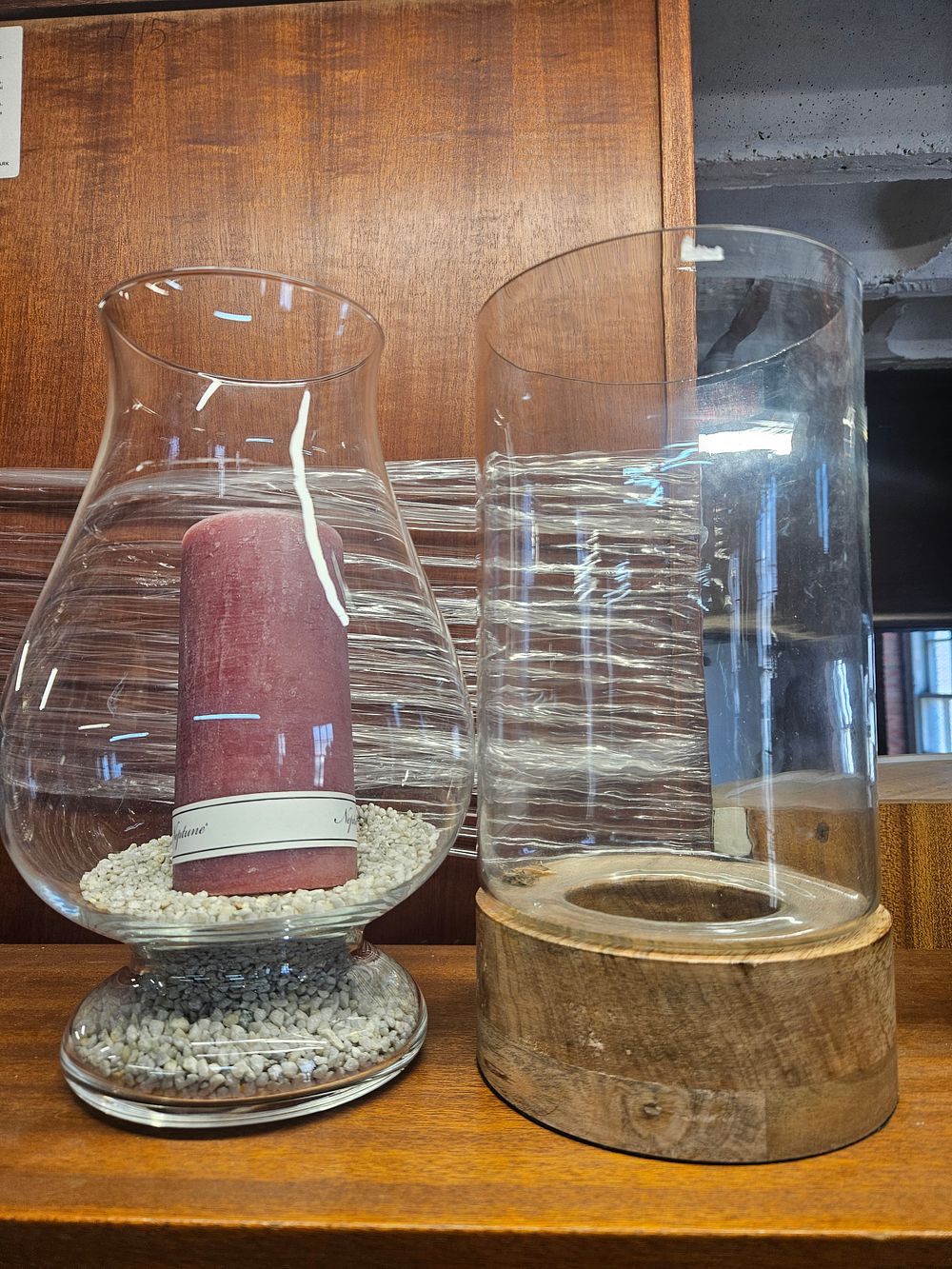Lot 222 – Two Contemporary Glass Hurricane Vases and a Neptune Pillar Candle