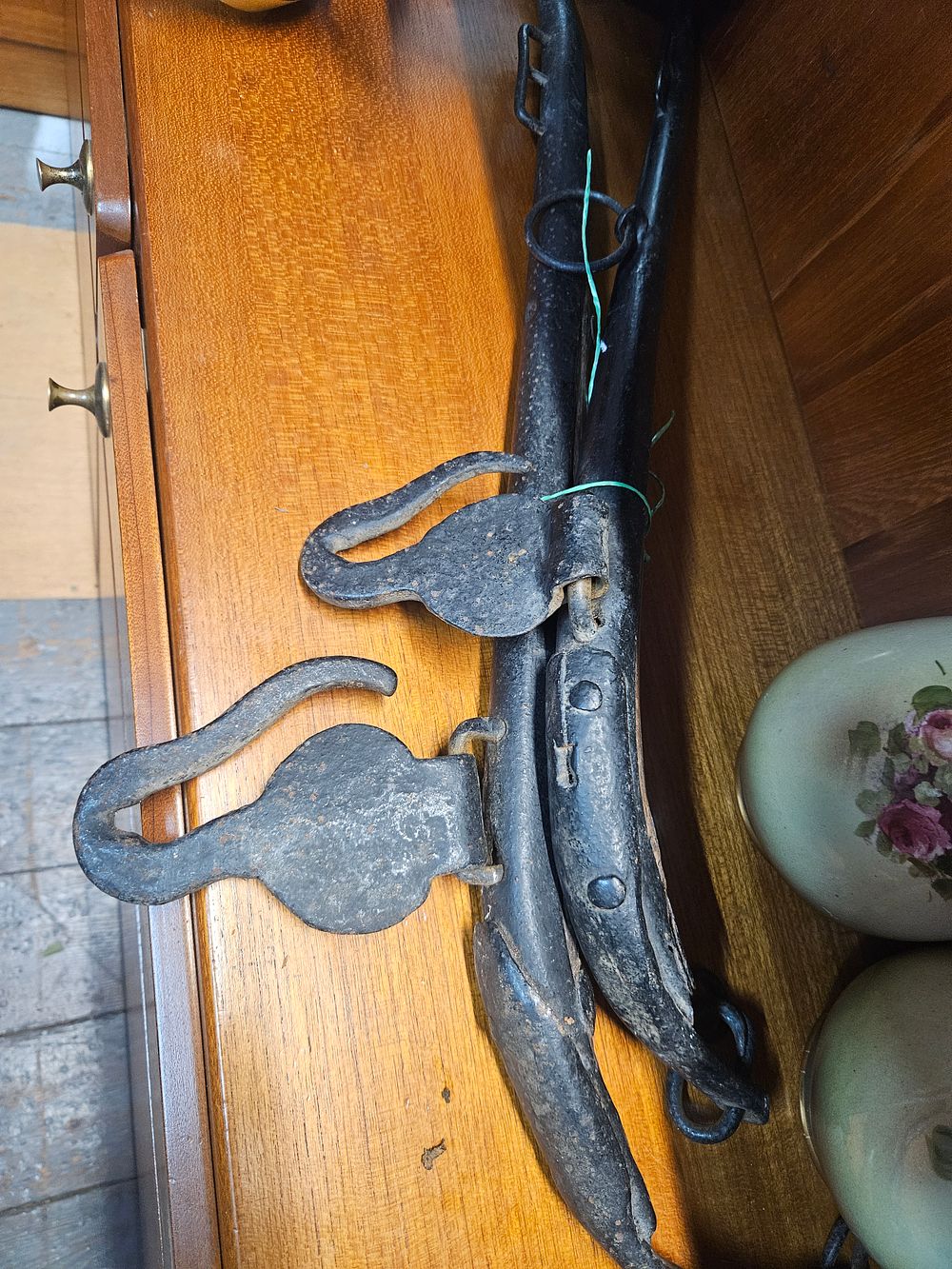 Lot 234 – A Pair of Antique Black-Painted Iron Horse Hames