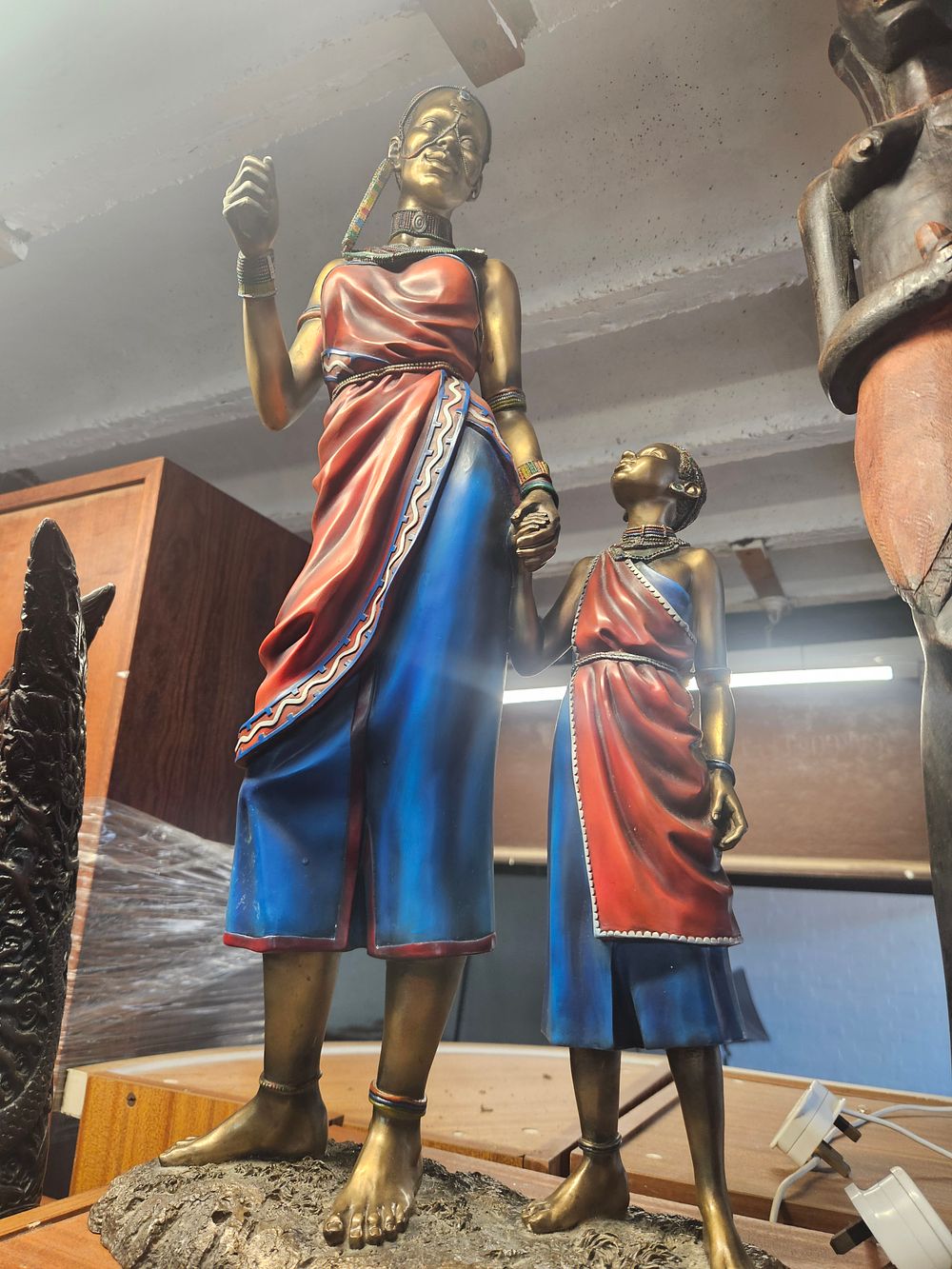Lot 236 – A Decorative Cold-Cast Resin Sculpture of Two Maasai Women Attributed to the Leonardo Collection