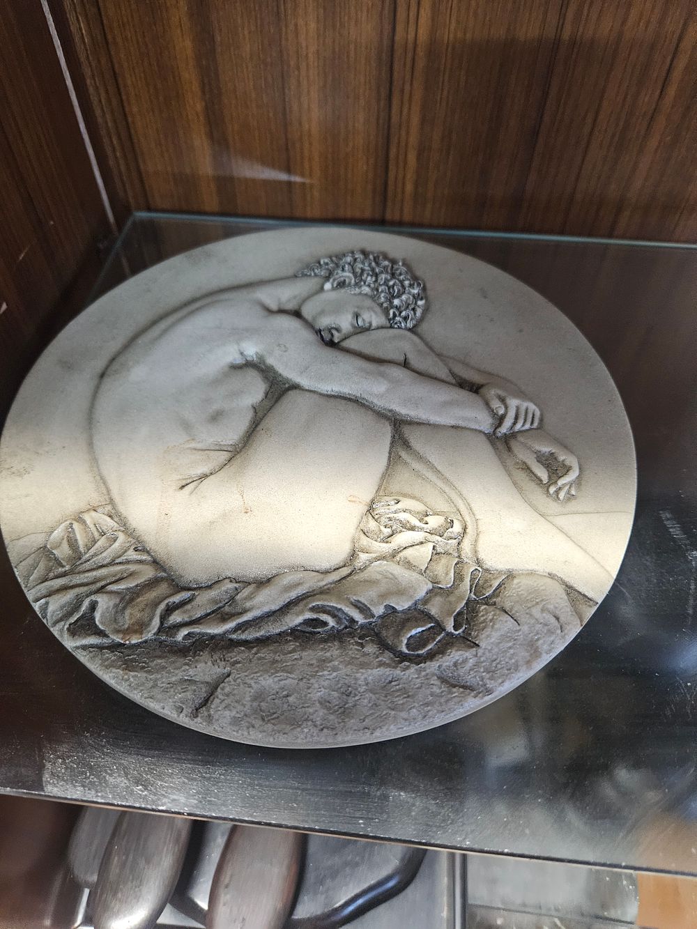 Lot 241 – A circular relief sculpture after Michelangelo’s Bearded Slave