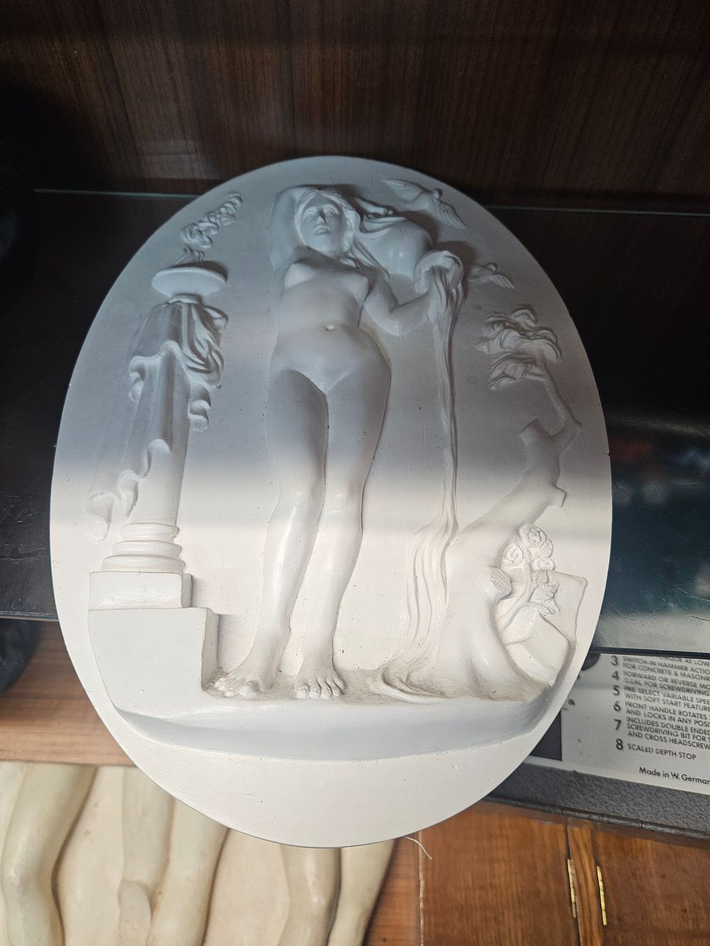 Lot 244 – A Neoclassical Style White Cast Plaster Bas-Relief Oval Plaque