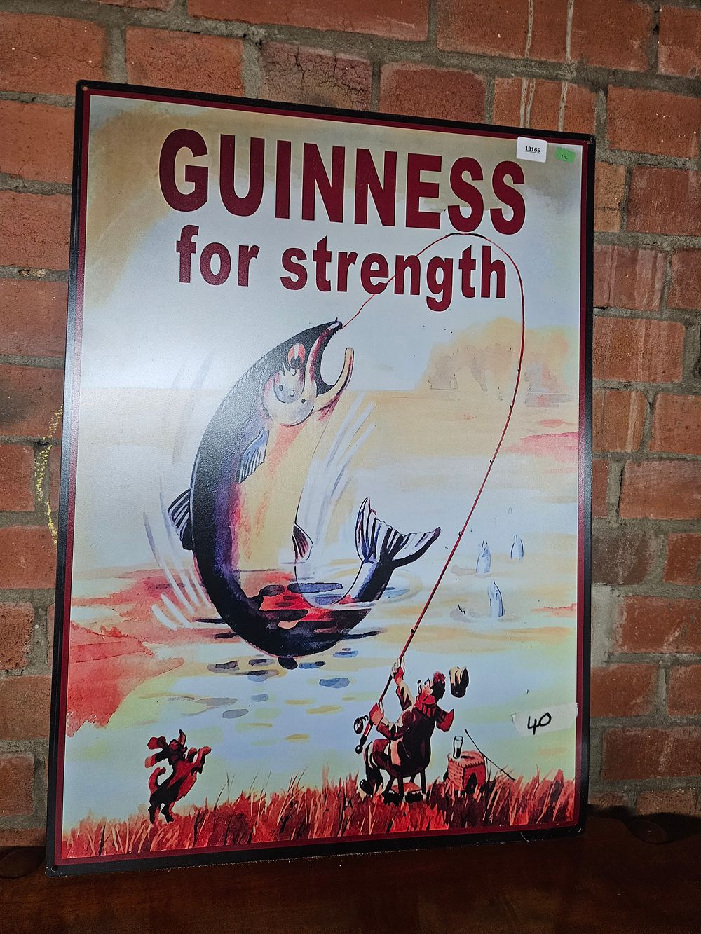 Lot 276 – A Reproduction Tin Guinness For Strength Advertising Sign