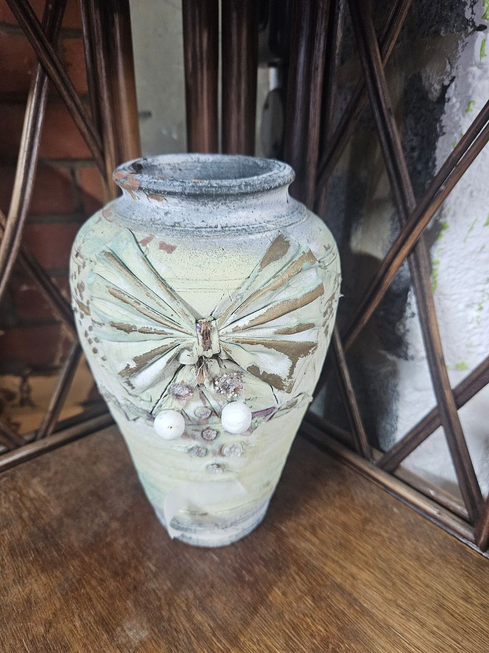 Lot 277 – A Contemporary Decorative Distressed Earthenware Vase with Applied Bow Motif