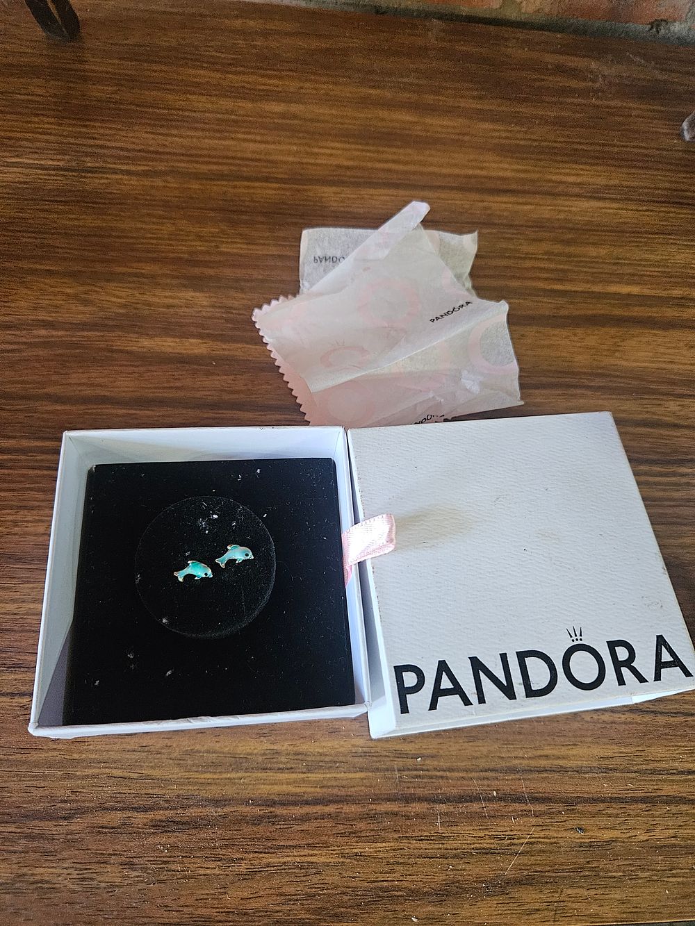 Lot 320 – A Pair of Sterling Silver and Blue Enamel Dolphin Stud Earrings in Pandora Packaging