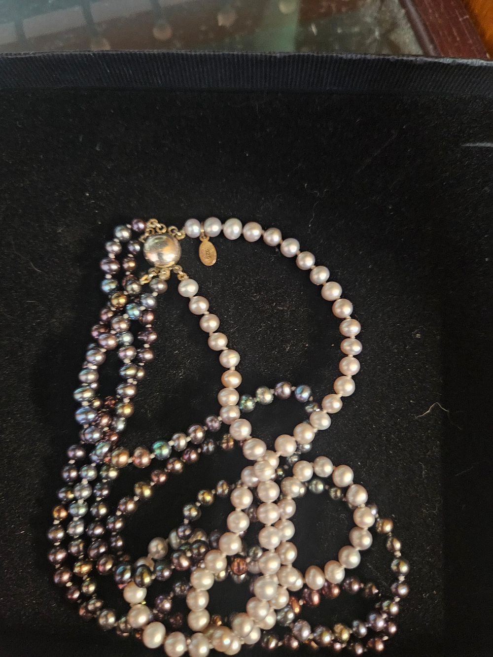 Lot 325 – A four-strand cultured pearl necklace with sterling silver gilt clasp