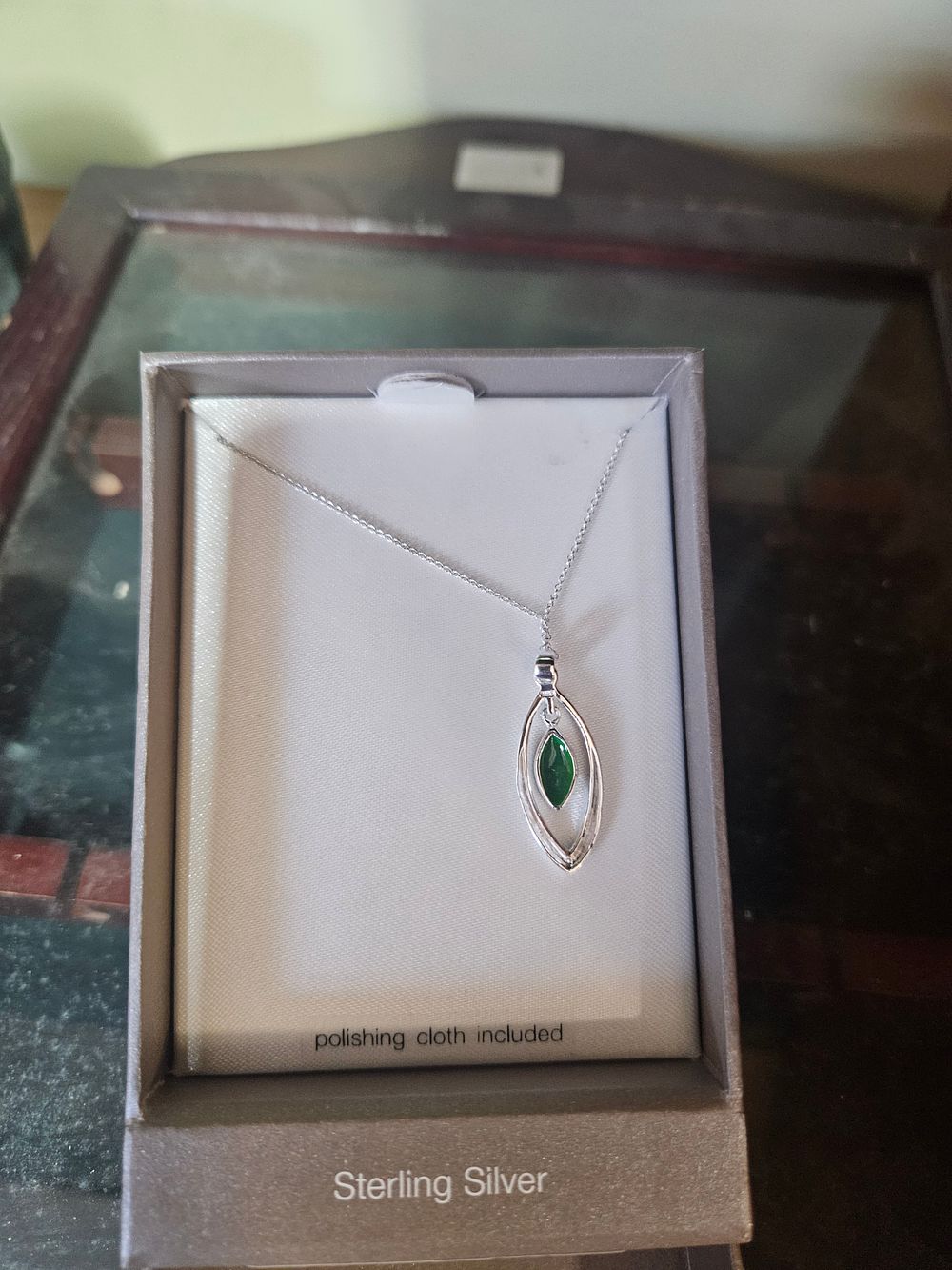 Lot 330 – Sterling Silver Openwork Marquise Pendant Necklace with a Green Gemstone