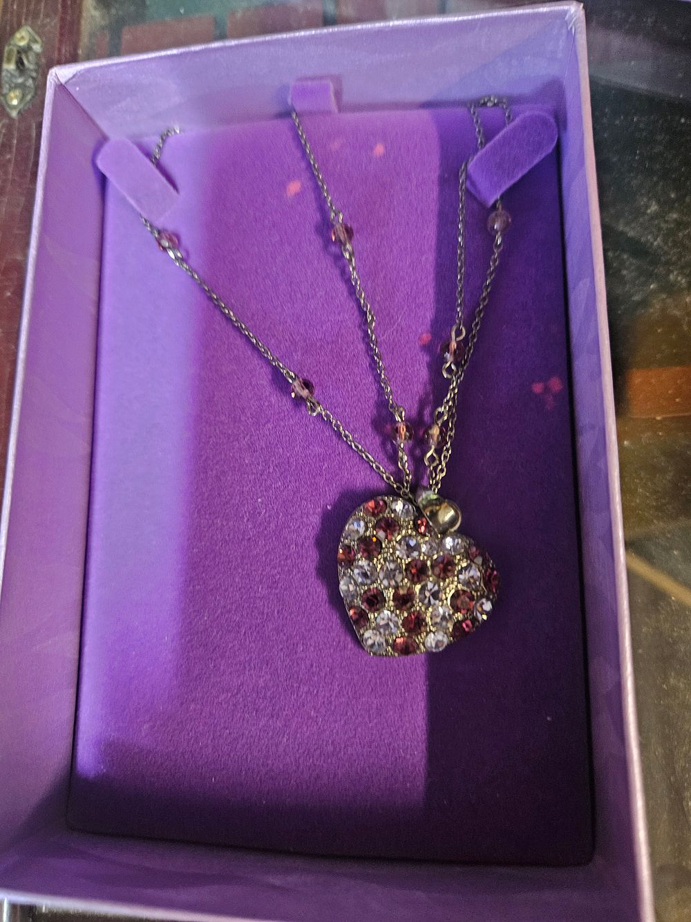 Lot 332 – A Silver-Tone Multi-Strand Heart Pendant Necklace with Purple and Clear Pave-Set Stones