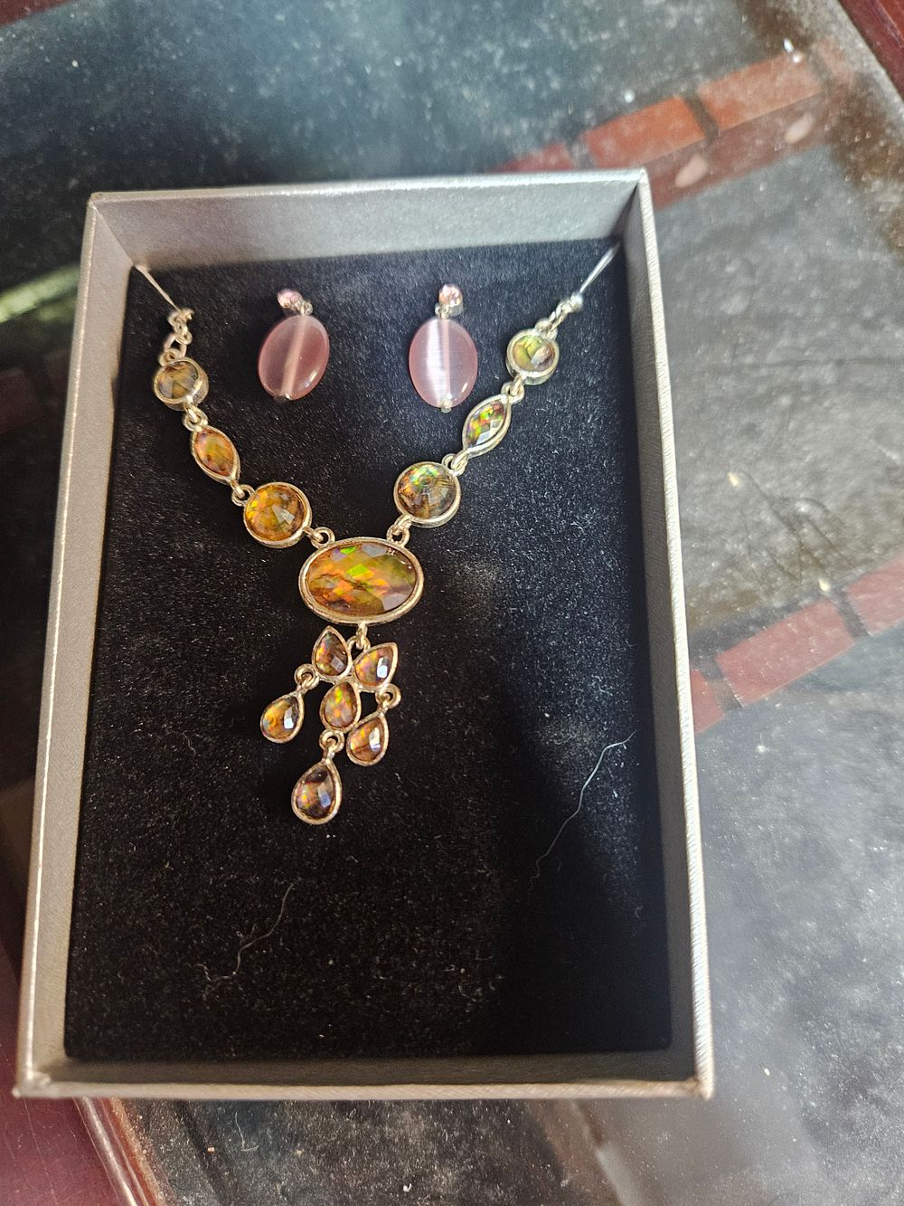 Lot 337 – A Yellow Gold-Tone Iridescent Stone Pendant Necklace and a Pair of Pink Cat’s Eye Style Earrings