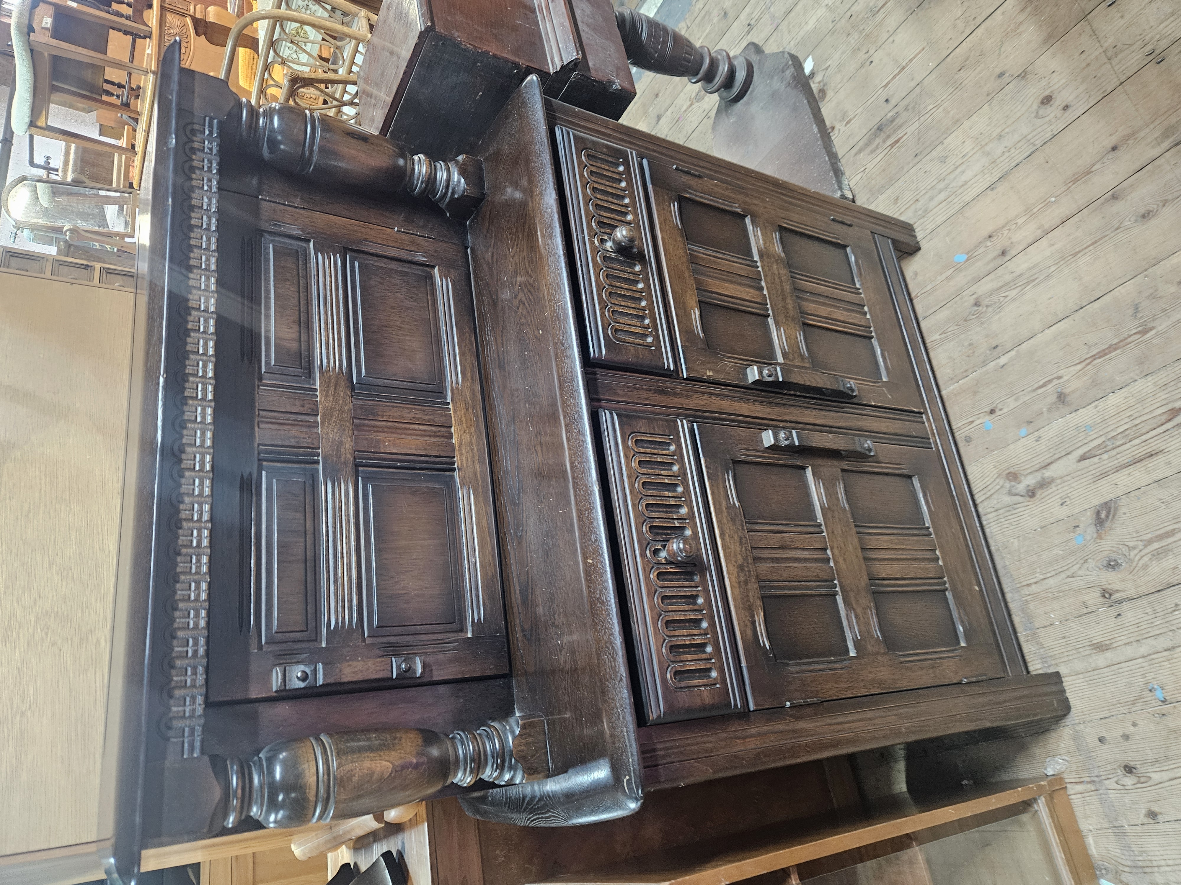 A mid-20th century oak ercol court cupboard