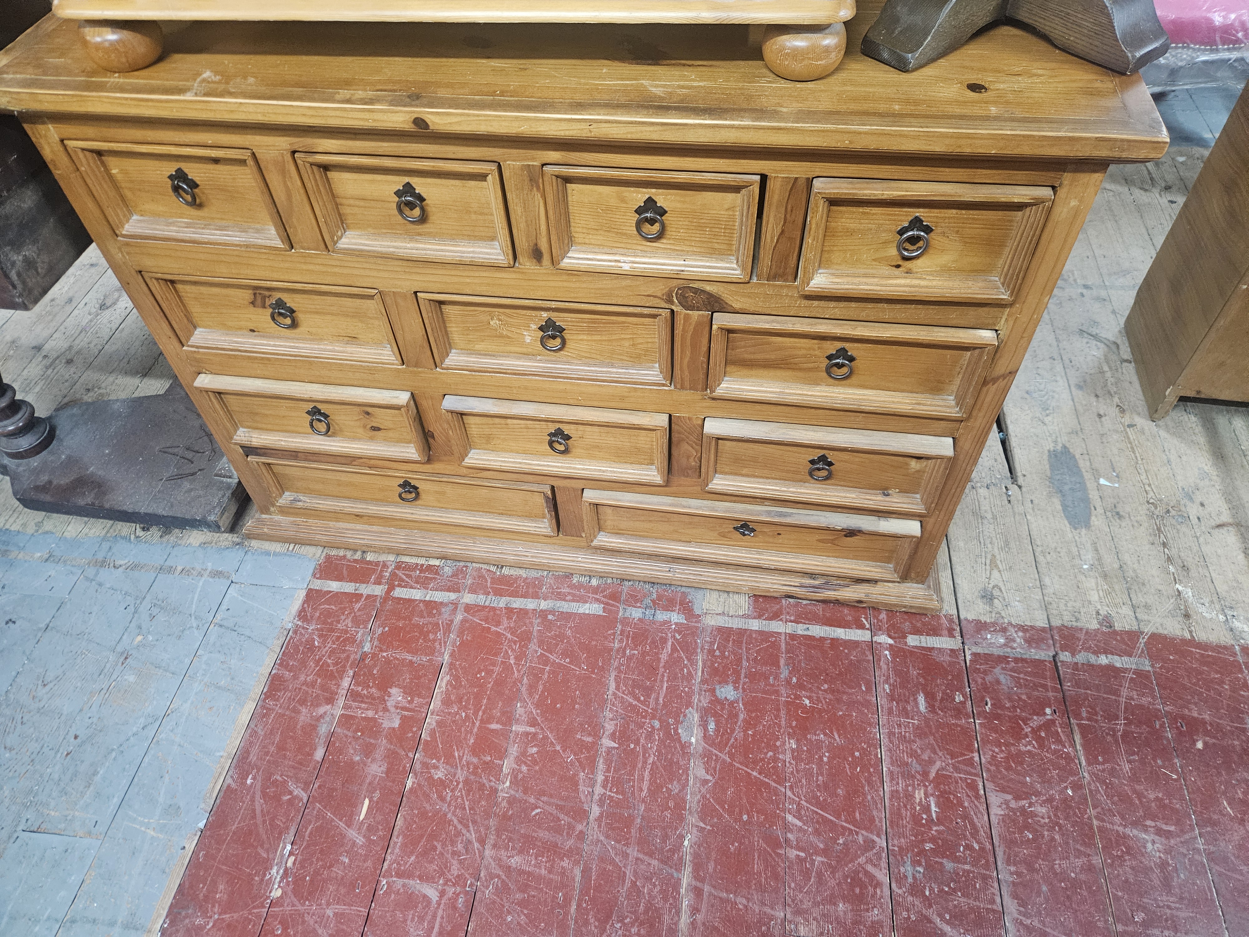 A contemporary pine apothecary-style twelve-drawer chest