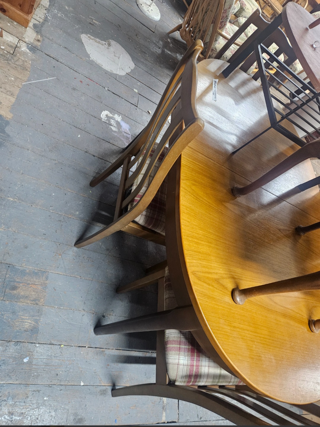A Mid-Century Modern Teak-Veneered Dining Table and a Set of Matching Chairs