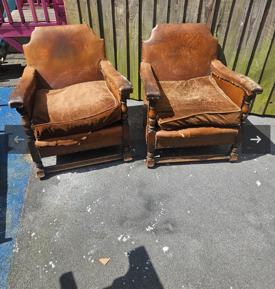 A Pair of Early 20th Century Jacobean Revival Oak and Leather Armchairs