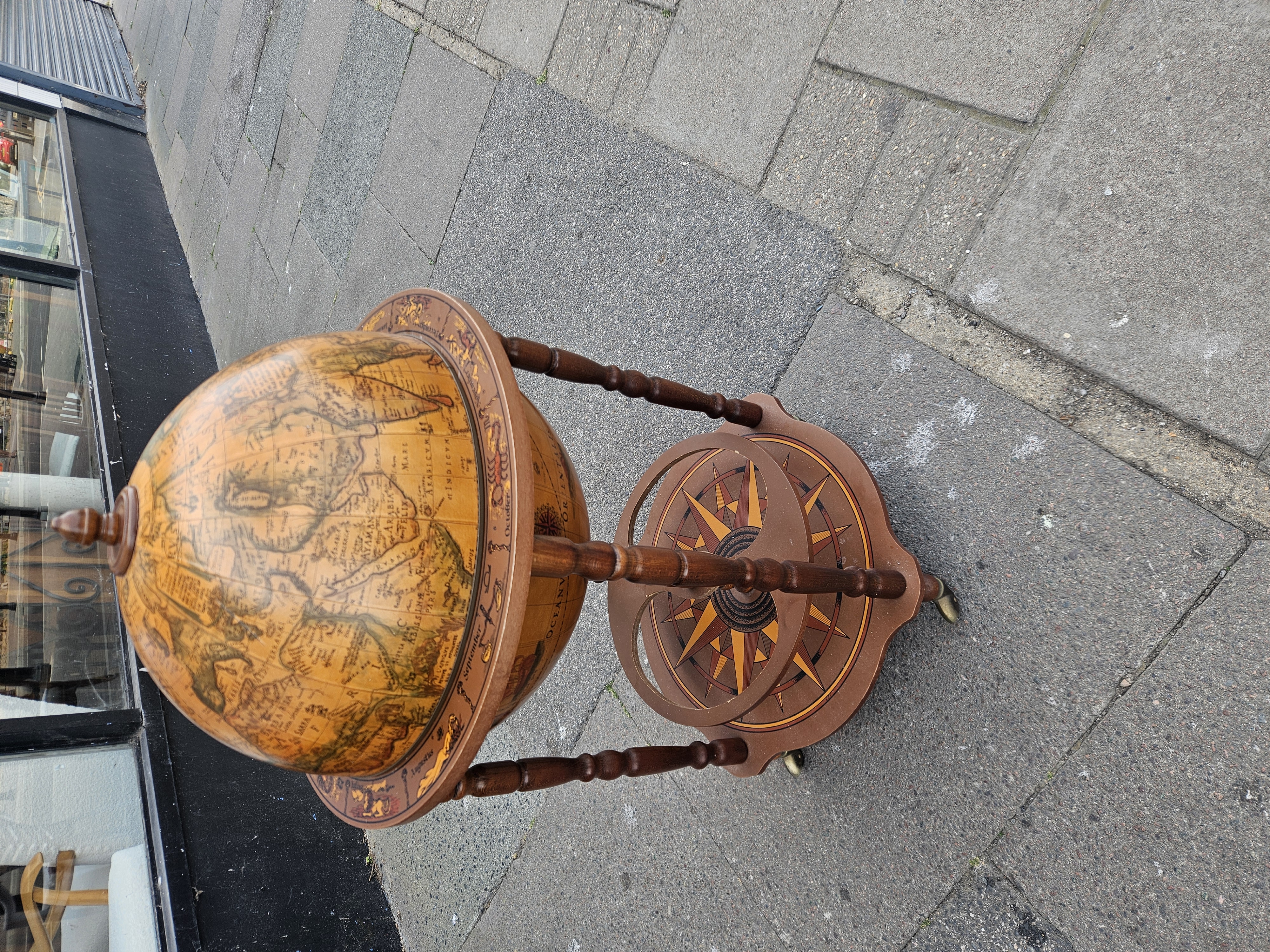 A Floor-Standing Italian Style Reproduction Globe Bar Cart