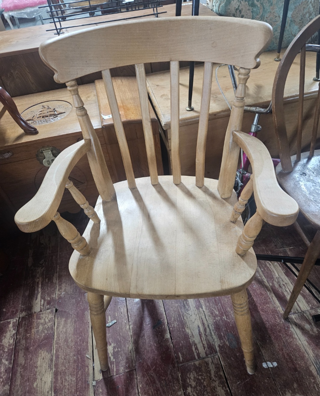 A 20th-century English vernacular beech and elm smoker's armchair
