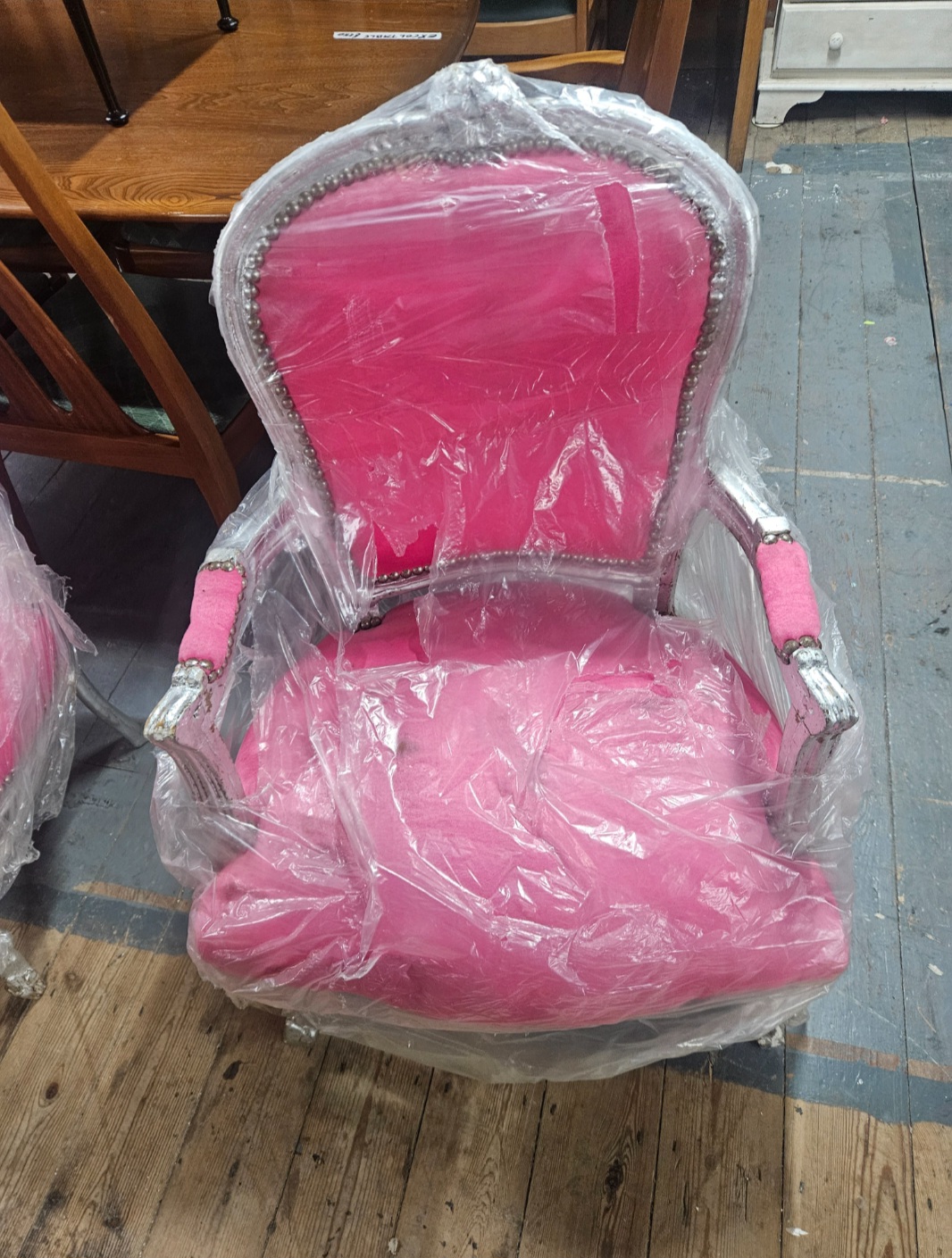 A contemporary Louis XV style silvered and fuchsia velvet armchair