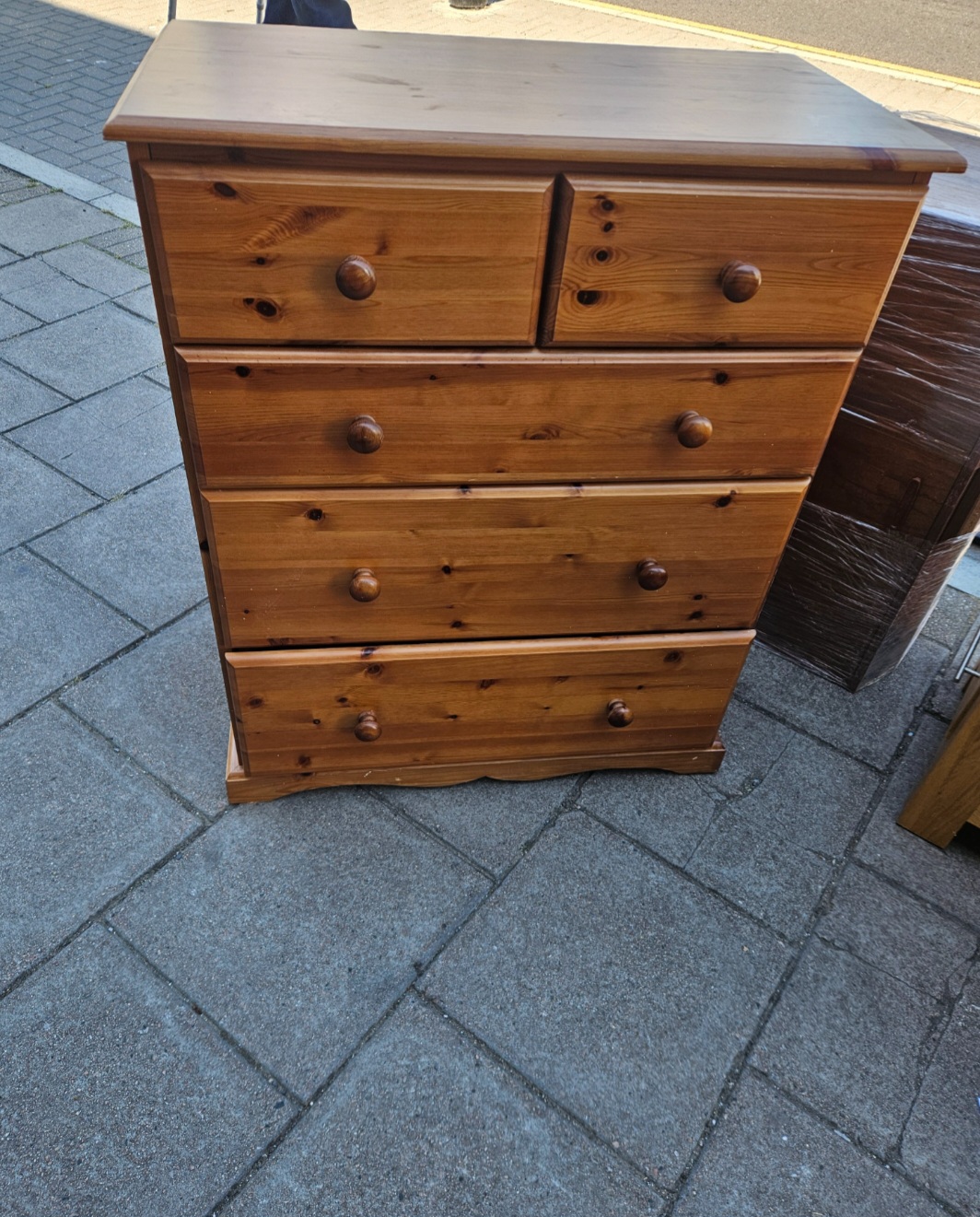 A Stained Pine Two-over-Three Chest of Drawers