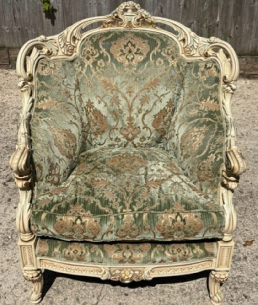 A Louis XV Style Cream Painted and Gilded Carved Bergère