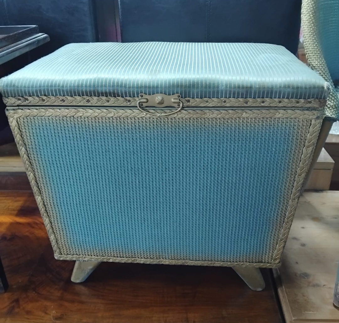 A mid-20th century turquoise woven storage ottoman or sewing box