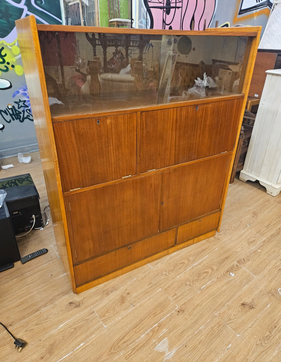 A Mid-Century Modern Teak Highboard Cabinet with Sliding Glass Doors and Twin Cupboards af