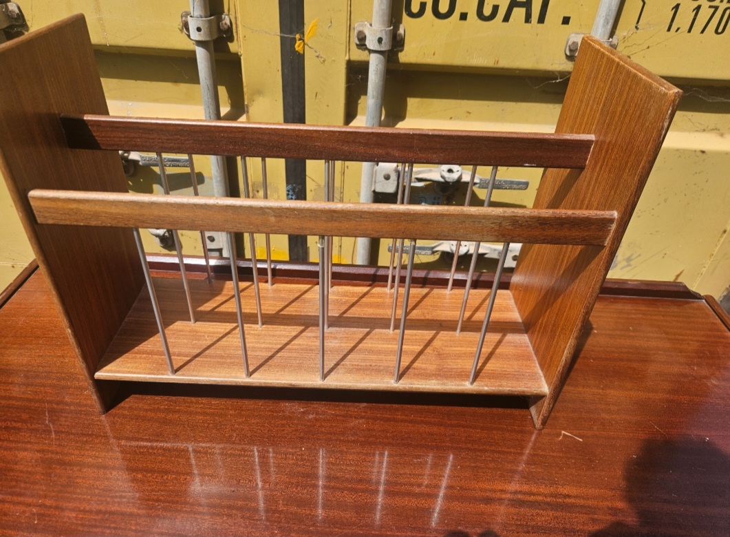 A Mid-Century Teak and Metal Record or Magazine Rack