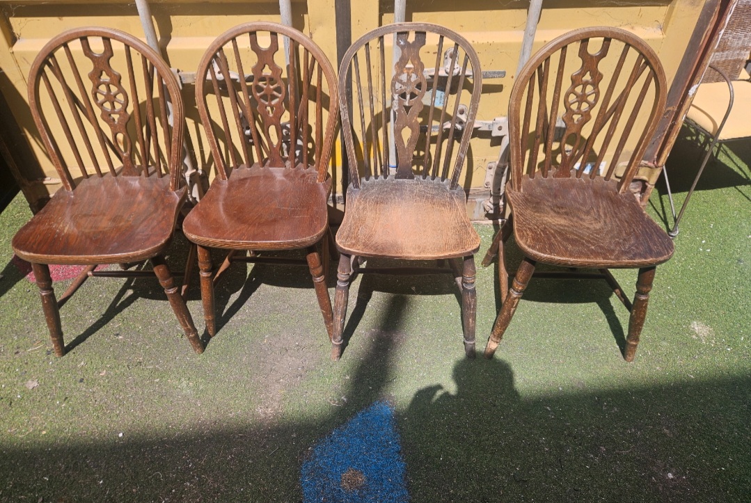 A Set of Four Beech and Elm Wheelback Windsor Dining Chairs