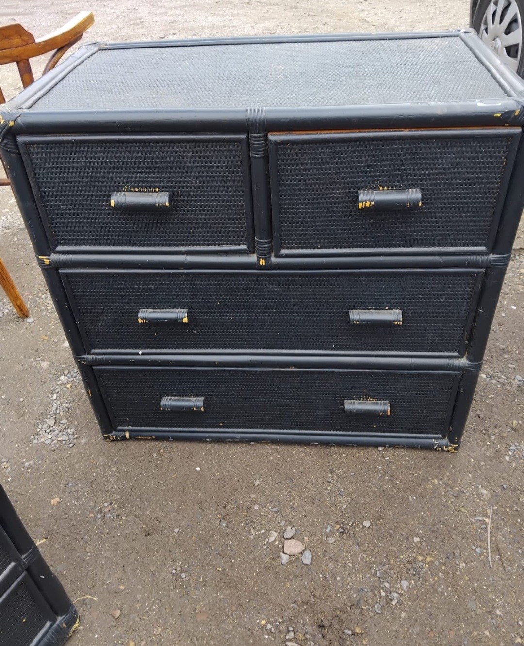 A Black Painted Faux Bamboo and Woven Panel Chest of Drawers
