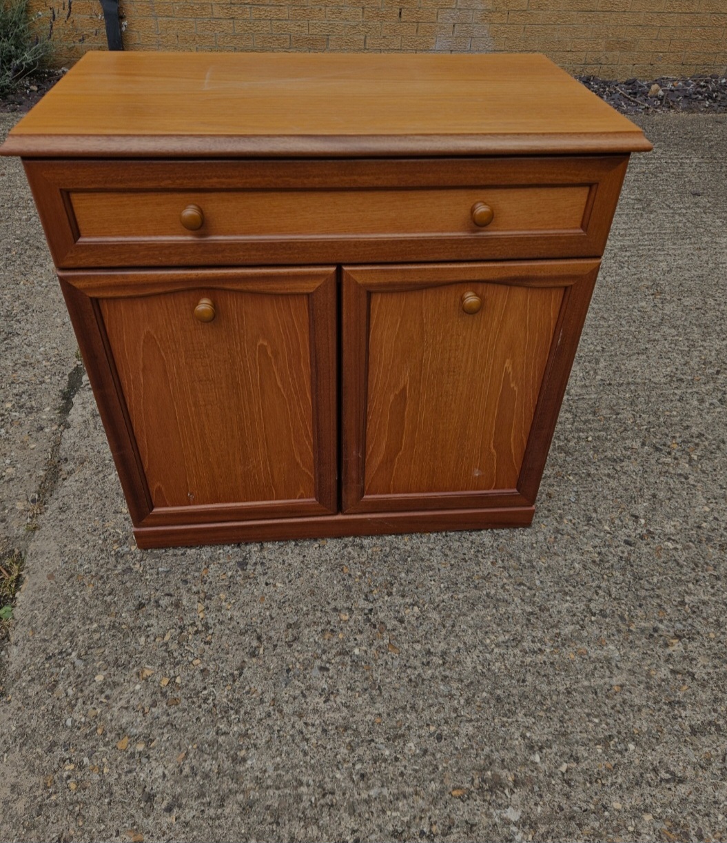 A late 20th-century light wood sideboard with single drawer and twin cupboard doors