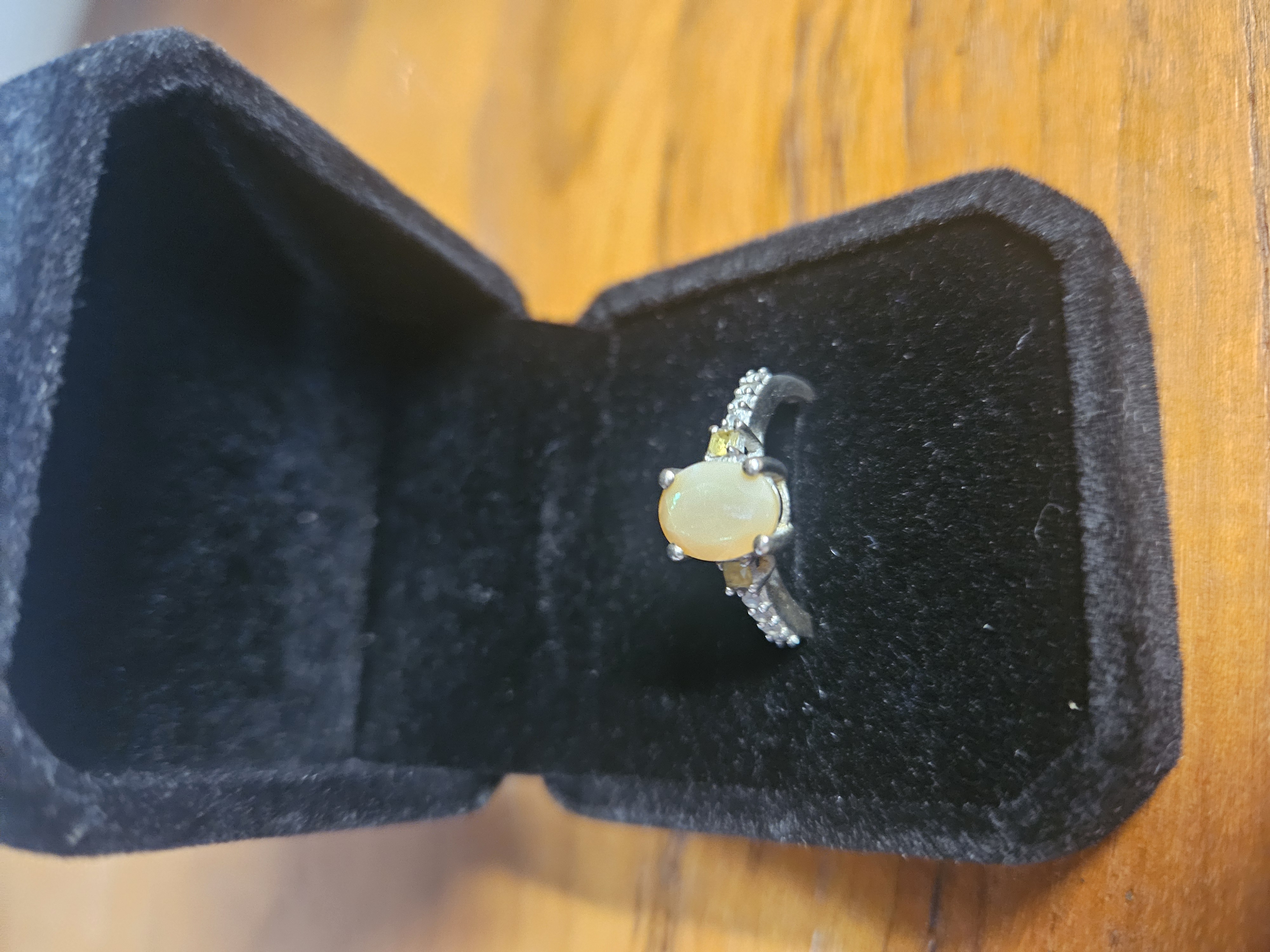 A Sterling Silver Opal and Yellow Gemstone Dress Ring