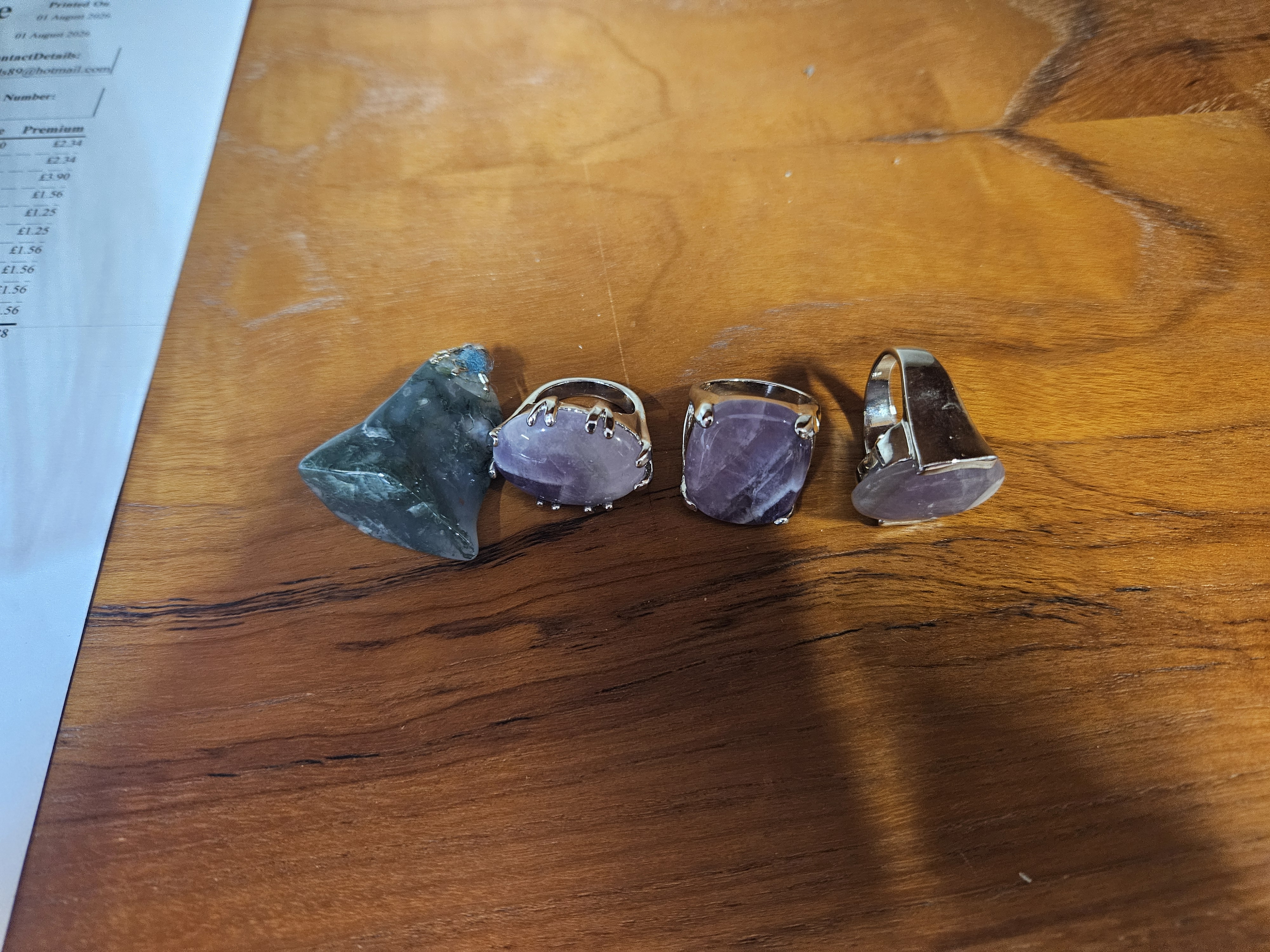 A Collection of Amethyst Dress Rings and an Agate Specimen