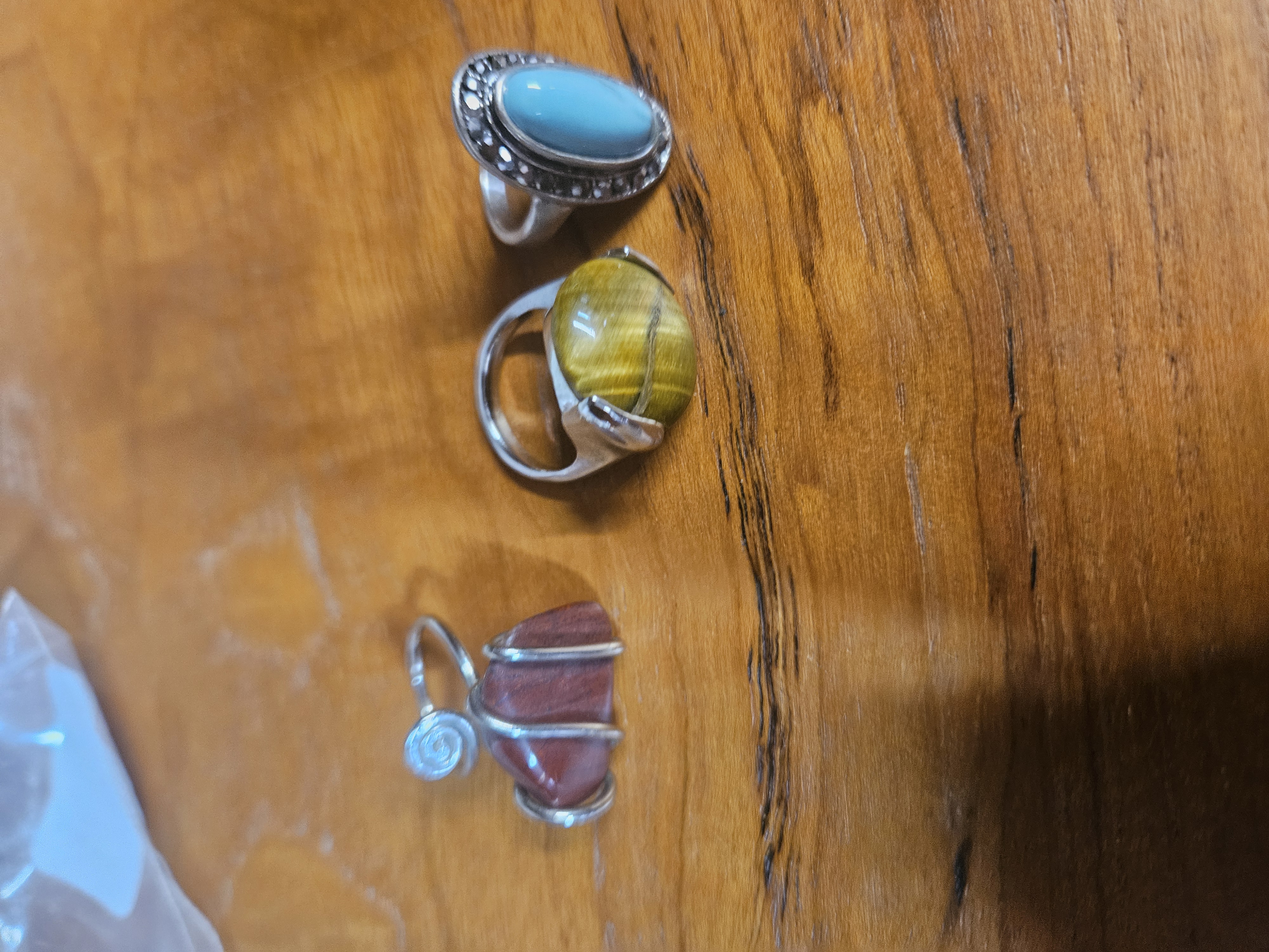 A Trio of White Metal and Semi-Precious Gemstone Cocktail Rings