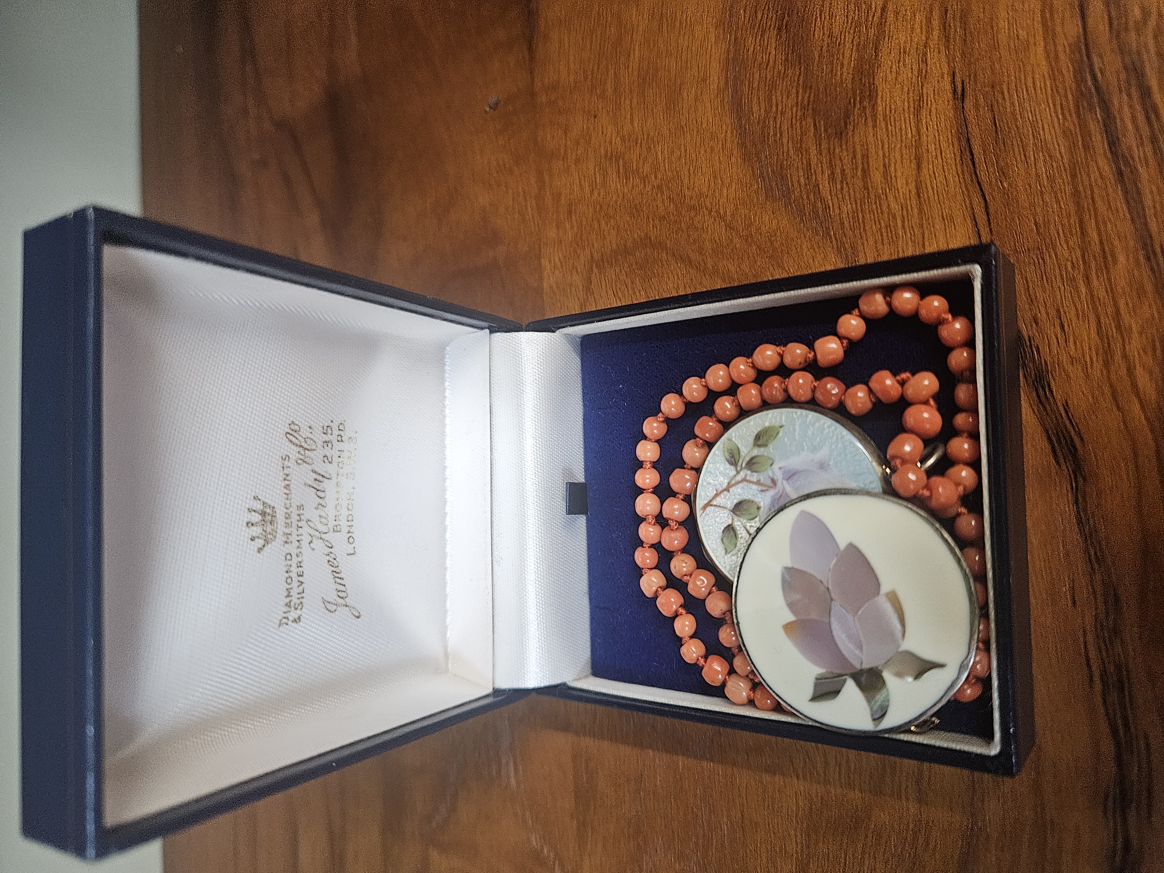 Three Items of Coral and Shell Inlay Jewellery in a James Hardy and Co Presentation Case