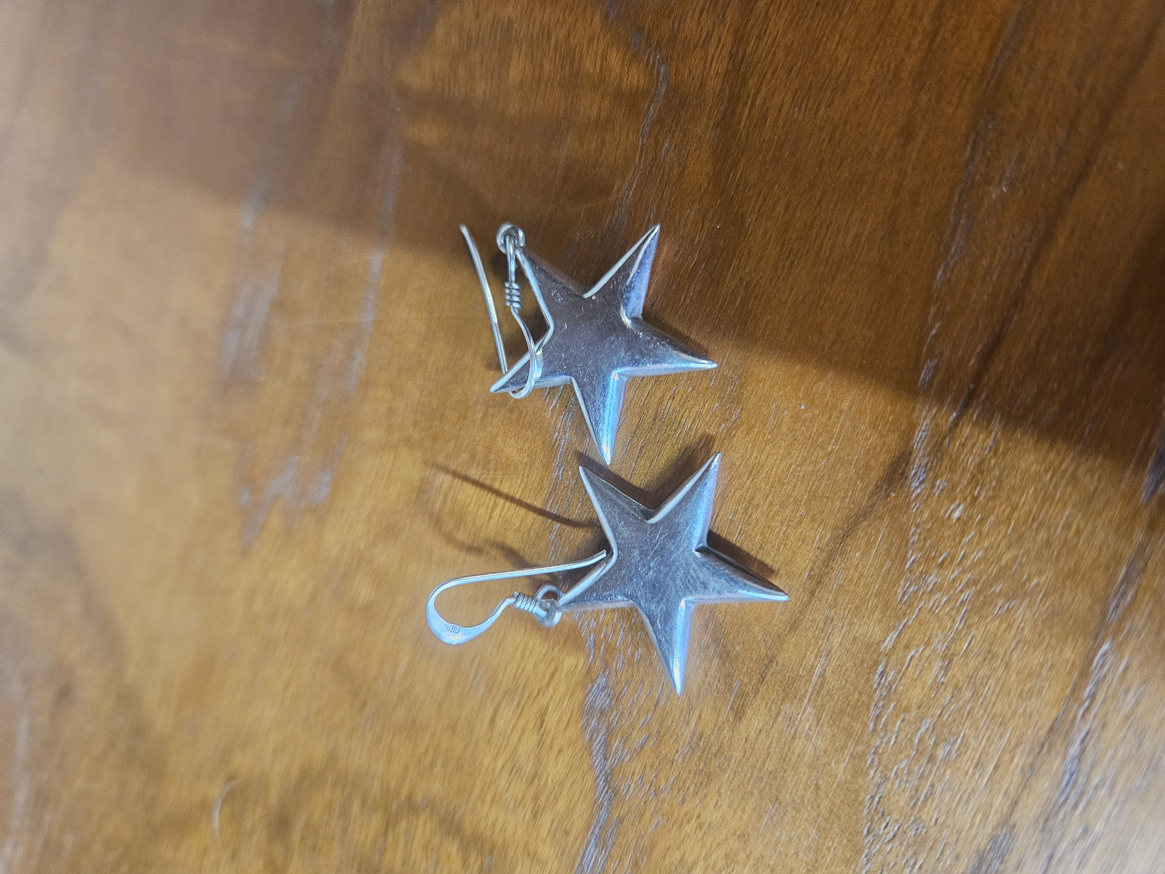 A Pair of Sterling Silver Puffed Star Drop Earrings