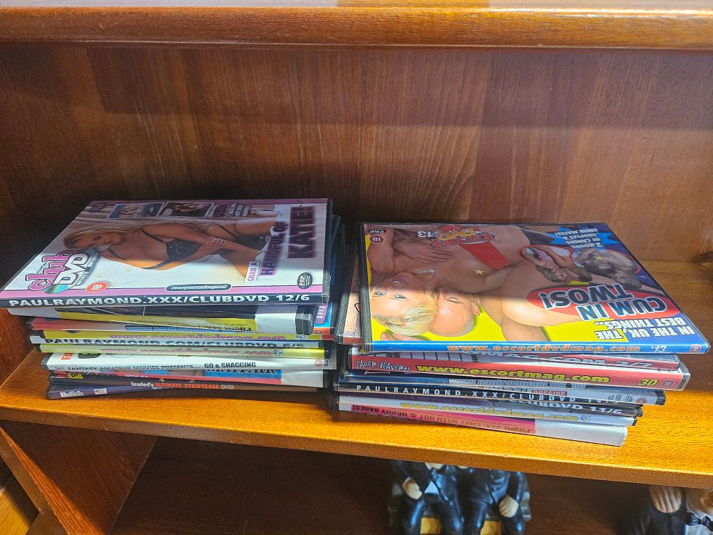 Lot 207 – A Collection of Thirteen Adult and Erotic DVDs including Paul Raymond and Escort Titles