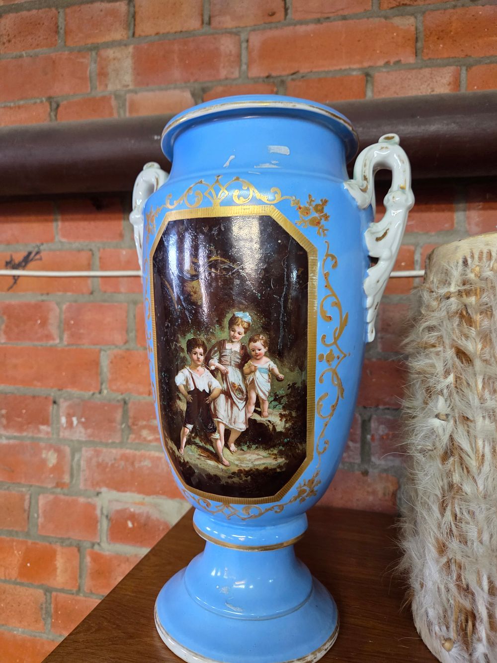 Lot 227 – A Victorian Ceramic Pedestal Urn with Children Scene