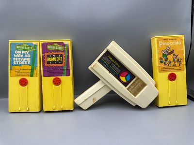 Fisher-Price Movie Viewer and Film Cartridges Featuring Sesame Street and Disney Pinocchio