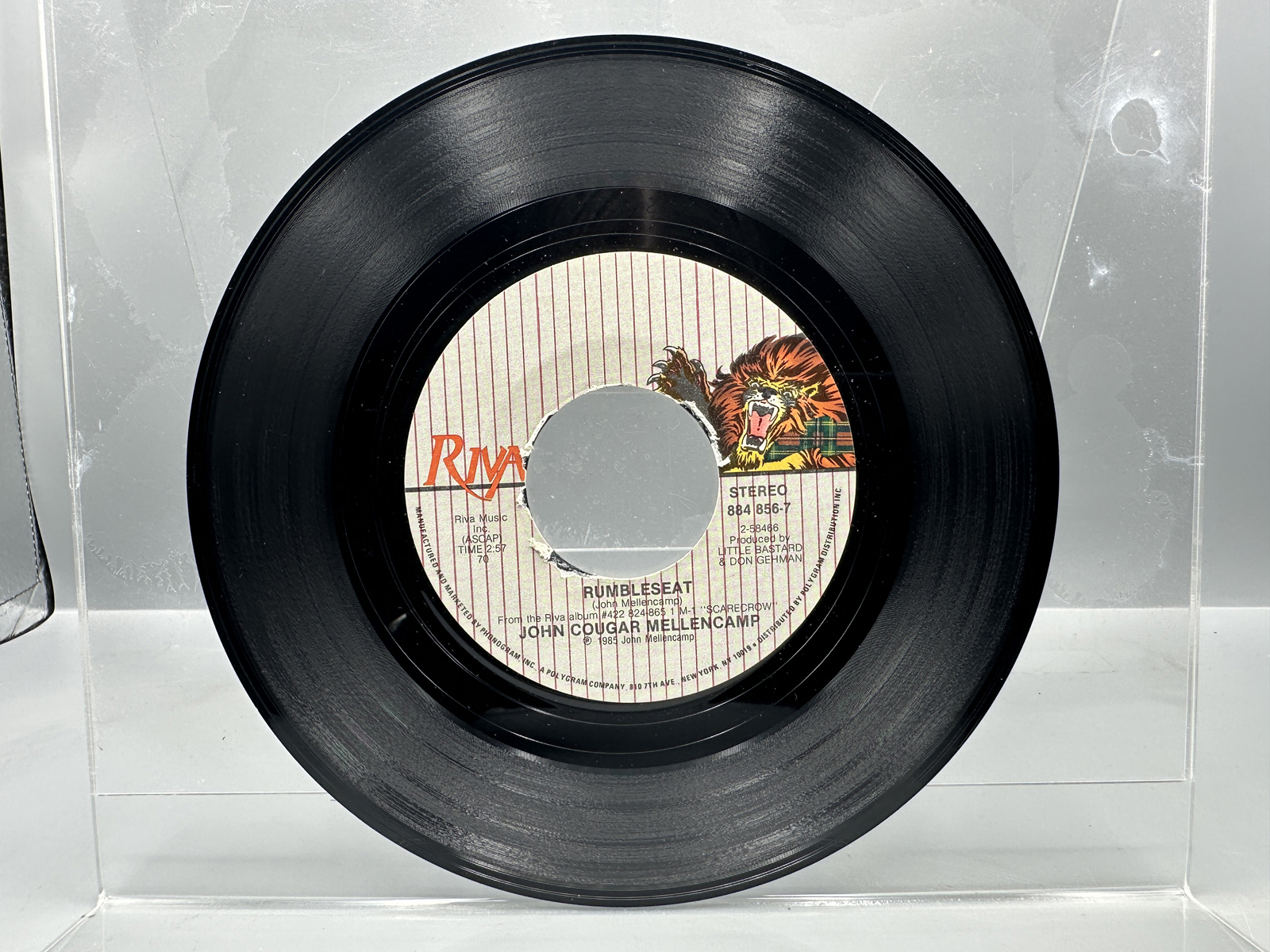 John Cougar Mellencamp: Scarecrow (1985), Club Edition; AND Three (3) 7-inch 45 rpm records with picture sleeves: Rumbleseat; Rain On the Sc