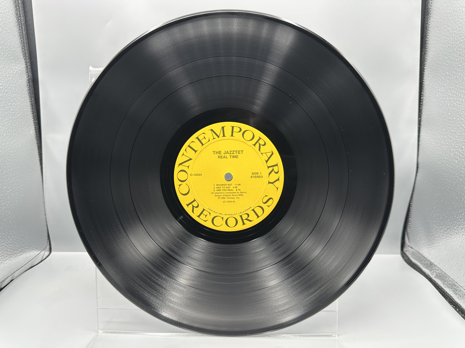 The Jazztet: Real Time (1988), promo stamp on back cover. The Jazztet includes Art Farmer and Benny Golson & features Curtis Fuller.