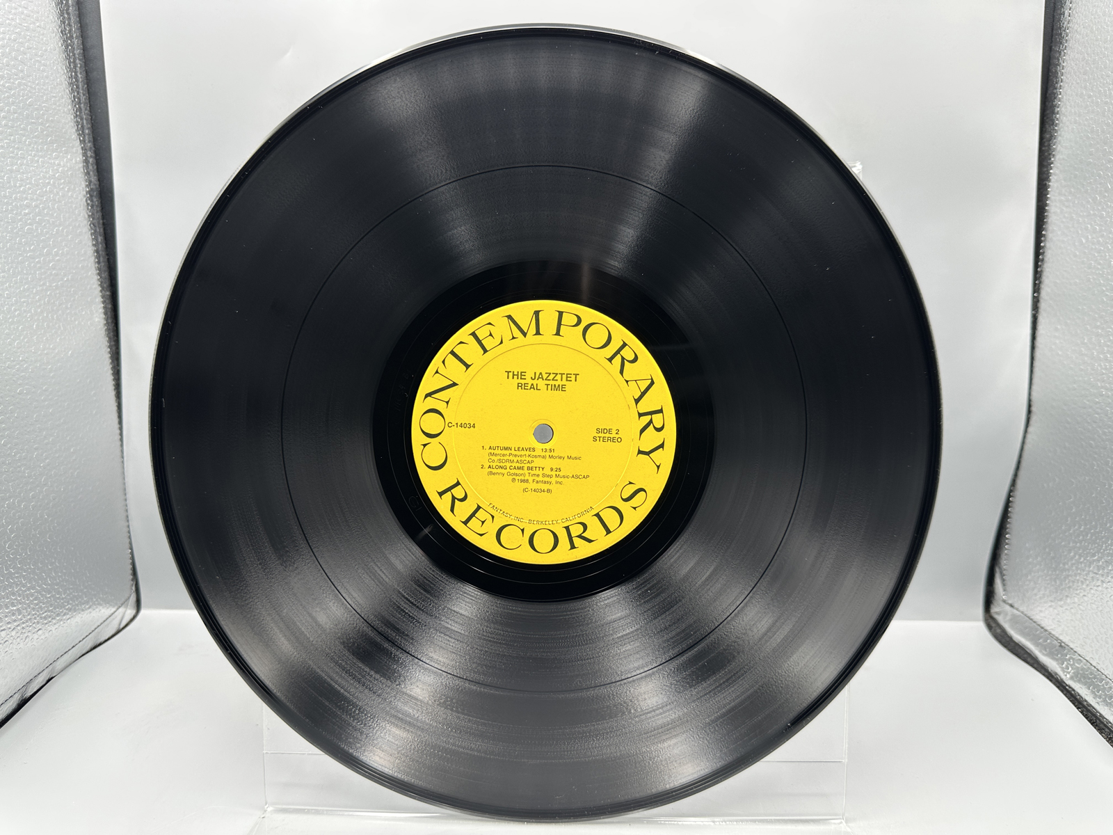 The Jazztet: Real Time (1988), promo stamp on back cover. The Jazztet includes Art Farmer and Benny Golson & features Curtis Fuller.