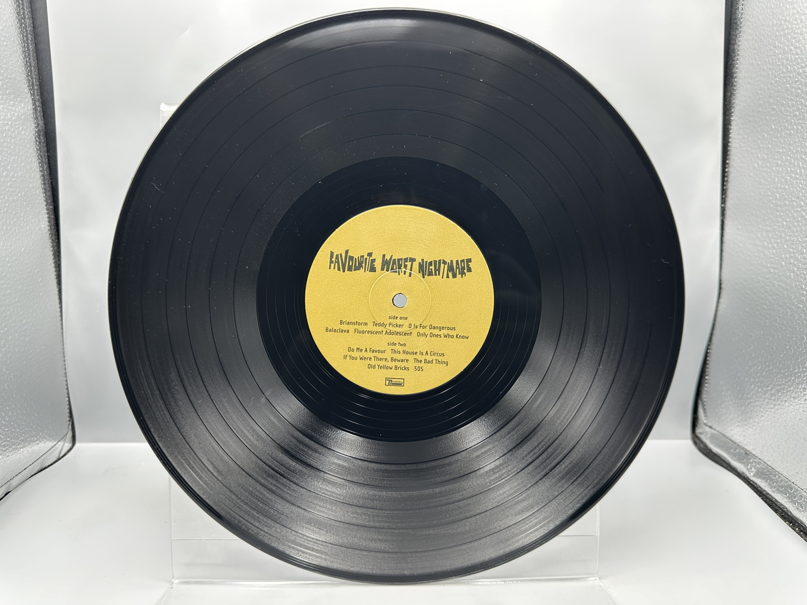 Arctic Monkeys: Favorite Worst Nightmare (2013), reissue, gatefold, minor 2-inch tear in cover's top seam