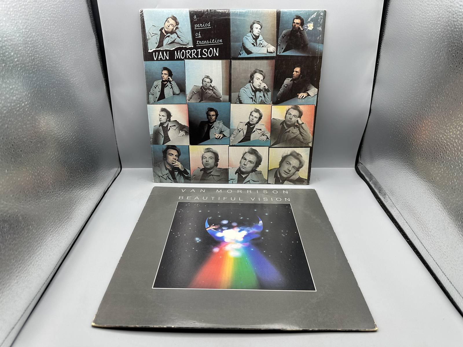 Van Morrison (2 LP Lot): A Period Of Transition (1977), promo hole in cover, in original shrinkwrap; and Beautiful Vision (1982)