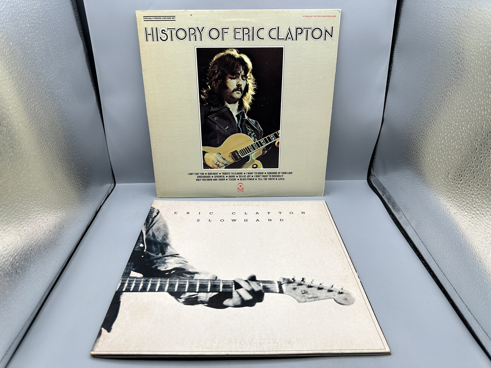 Eric Clapton (2 LP Lot): History Of Eric Clapton (1972), gatefold, 2 LPs; and Slowhand (1977), gatefold