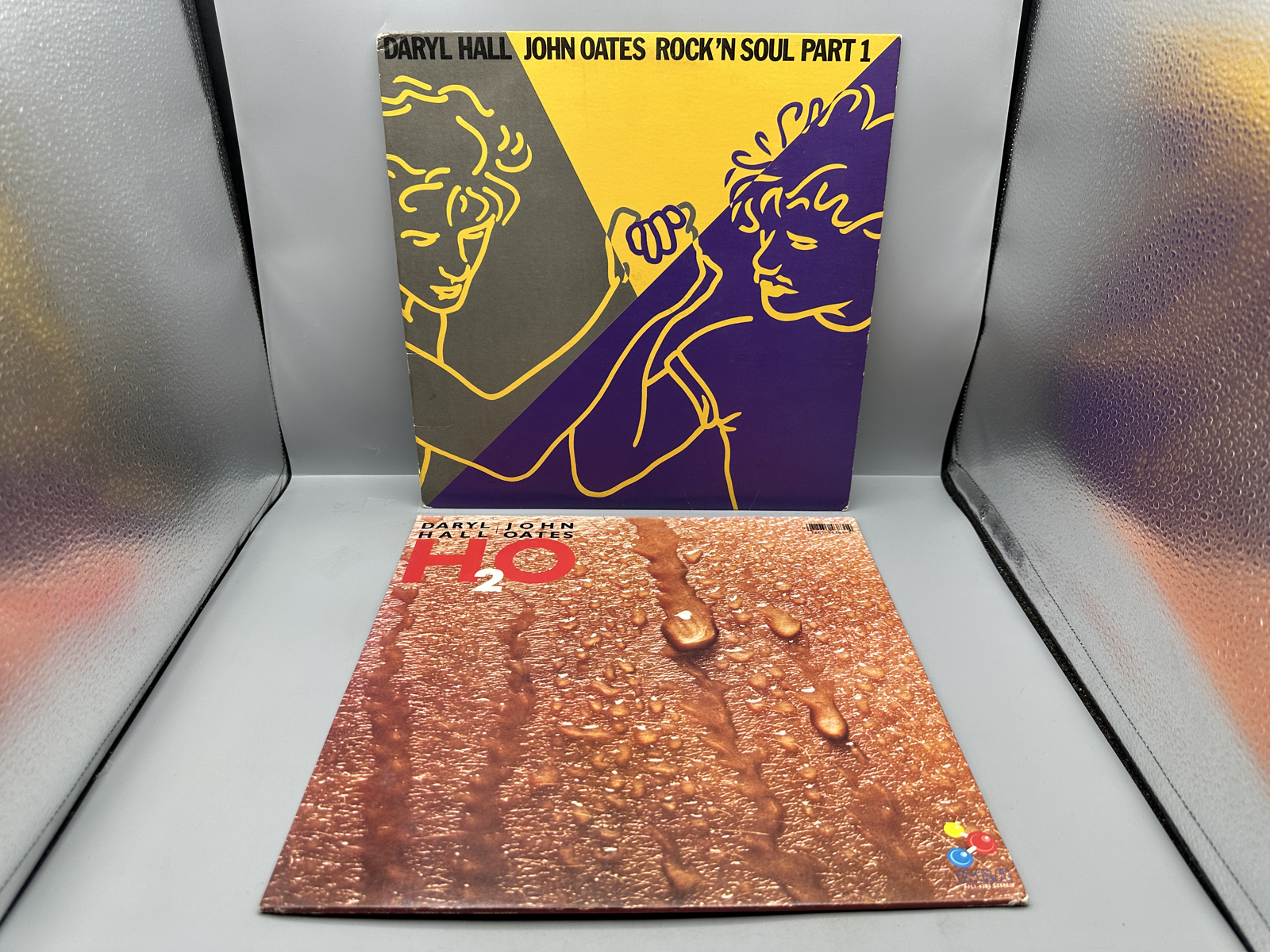 Daryl Hall & John Oates (2 LP Lot): Rock 'N Soul Part 1 (1983), includes calendar poster; and H2O (1982)