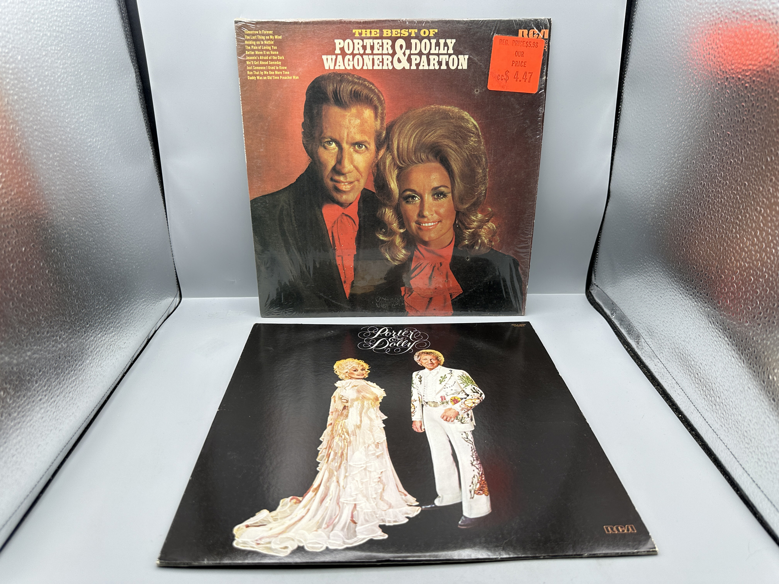 Porter Wagoner & Dolly Parton (2 LP Lot): The Best Of Porter Wagoner & Dolly Parton (1971), in original shrinkwrap with price sticker; and P